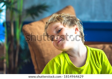 Portrait mischievous cute blond blue eyed boy making freckles face play laughing in happy mood. Funny photo, happiness lifestyle. Daycare, simple joys happy childhood, behaviour education psychology
