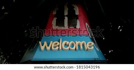 Welcome sign on the front of the house.