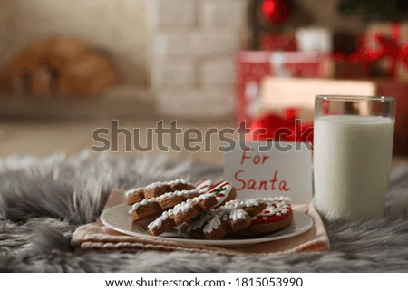 milk and Christmas cookies for Santa on the table. Christmas background