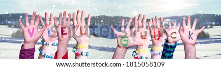 Kids Hands Holding Word Viel Glueck Means Good Luck, Snowy Winter Background