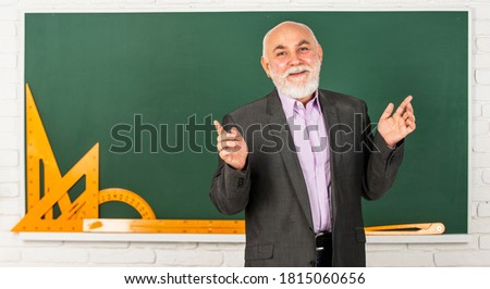 process for each solution. bearded lecturer man explain geometry. back to school. Math graphic tools. trigonometry lesson in classroom. get knowledge here. senior man teacher use math tools.