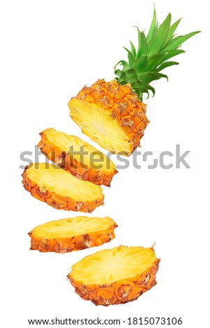 falling pineapple slices isolated on white background with full depth of field