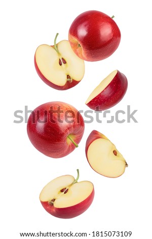 falling Red apple slices isolated on white background,