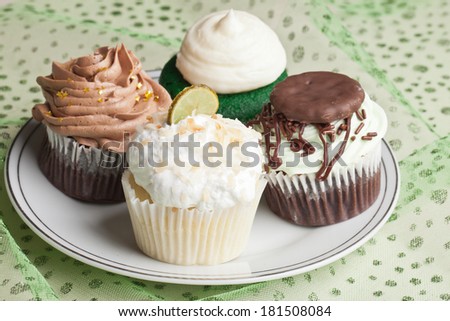 Coconut Key Lime Cupcake, Pot o' Gold chocolate caramel cupcake, Irish Mint cupcake, and Green Velvet cupcake for St. Patrick's Day