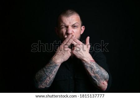 Emotional man portrait on black background
