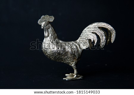 metal roe figurines on a black background