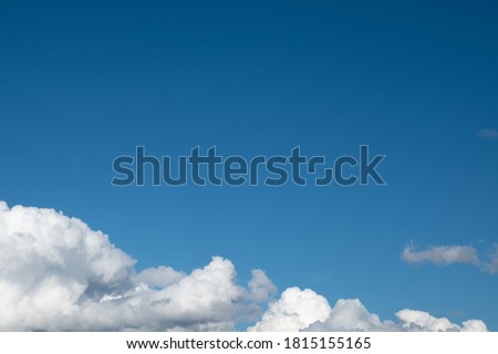 photo of clouds in the blue sky on a bright Sunny day