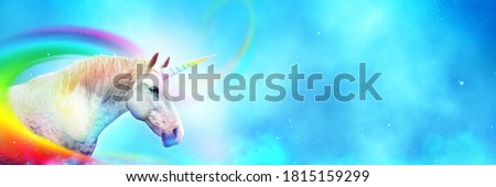 Ancient mythical unicorn with colorful rainbow. Panoramic style with wide copy space.  Royalty-Free Stock Photo #1815159299