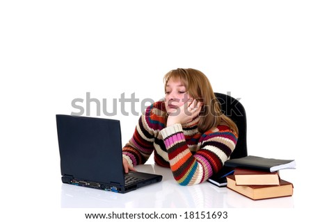 Teenager student doing homework with laptop and books on desk, with background, reflective surface