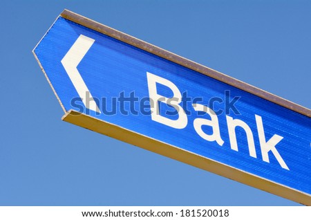 Bank street sign post with arrow isolated on blue sky background.Concept photo of Banking, bank, money, finance, economy, mortgage, saving, investment, debt , business and loans.