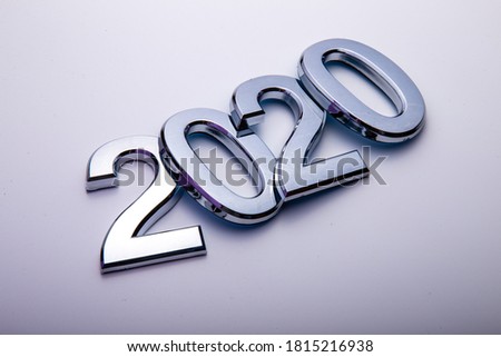 Happy New Year 2020. Symbol from number 2020 on bright background. Silver letters in the form of numbers 2020.