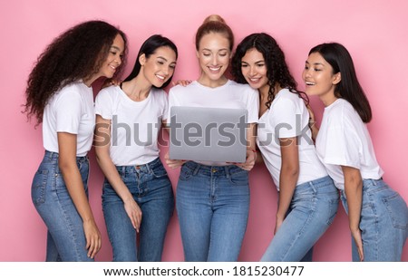 Group Of Multiracial Women Using Laptop Computer Standing Over Pink Background. Internet Browsing, Web Study, Online Education, Services And Technologies Concept. Studio Shot