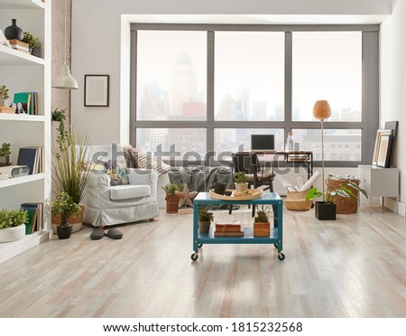 Living room interior style, city view background, armchair working table and laptop, middle coffee table style.