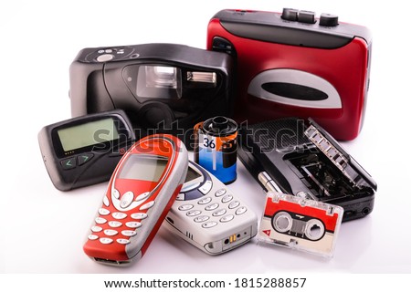 old obsolete items collected in a group on white background Royalty-Free Stock Photo #1815288857