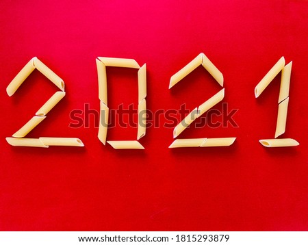 2021 numbers from pasta on red background