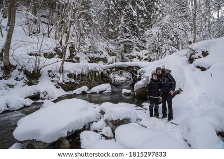 Couple in the cold with lots of snow in the ALps