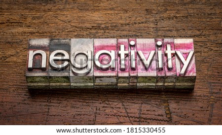 negativity word abstract in gritty vintage letterpress metal type  against rustic, weathered wood, work, stress, mindset  and lifestyle concept