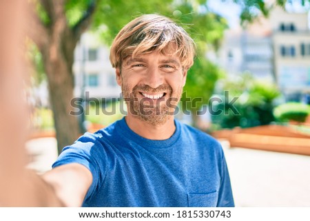 Young irish man smiling happy making selfie by the camera at the park.