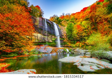 Waterfall view in autumn. The autumn colors surrounding the waterfall offer a visual feast. colorful leaves of autumn. Suuctu waterfalls, Bursa, Turkey.