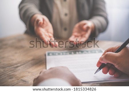 businessman is negotiating, advising, and explaining the matter of the contract to be agreed to sign the contract.