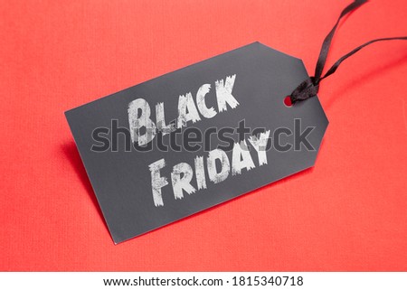 Black Friday tag for sale action in shop on the red background. Discount sticker template.