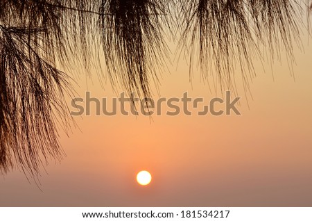 Bright sunrise under the sea surface with yellow red gradient colors