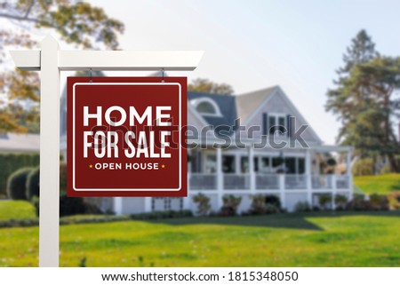 Home For Sale and Open House Real Estate Sign in front of a typical American style house.