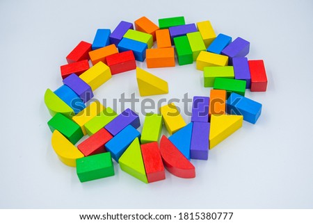 Untidy variety colorful blocks sleep and yellower block standing to see them