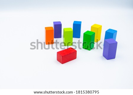 Untidy variety colorful blocks see sleep red block at white background