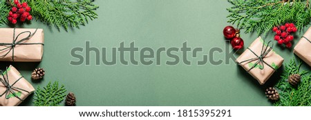 Long wide banner with bright Christmas decor on green background. Christmas and New Year greeting card template.