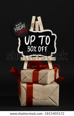 The concept black friday, the advertising frame and gifts on black background, buisiness promotional mockup.