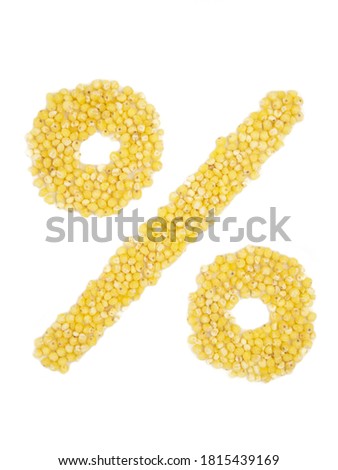 Sign of a percent from grain of millet on isolated white background.
