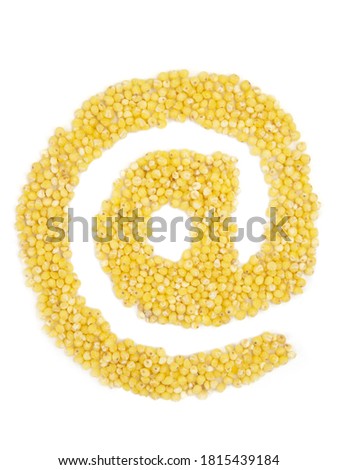 At the sign from grain of millet on isolated white background.