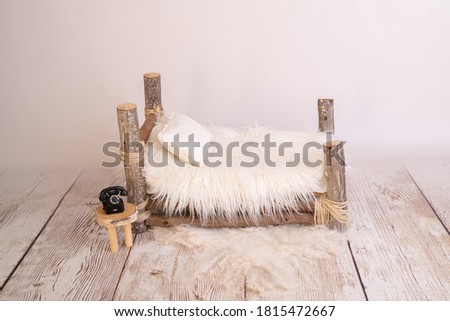 wooden bed newborn prop photography Royalty-Free Stock Photo #1815472667