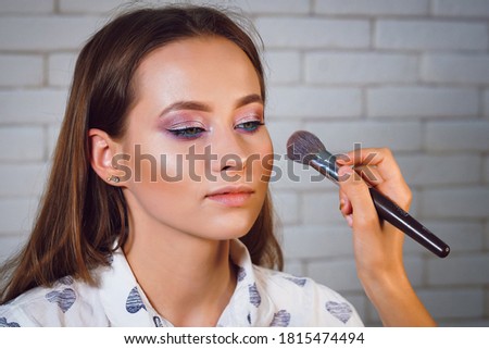the process of gentle makeup for a beautiful girl photo series