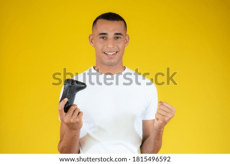 joyful man plays the console, joystick