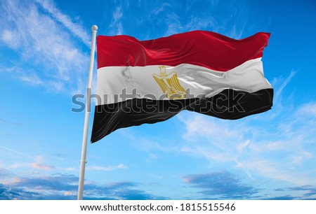 Large flag of Egypt waving in the wind Royalty-Free Stock Photo #1815515546