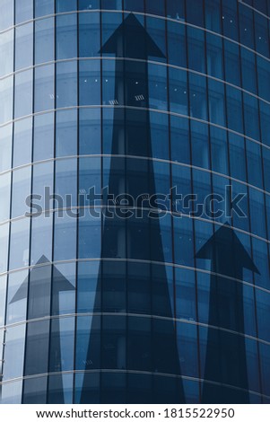 Business investment growth concept with abstract arrows on building. Royalty-Free Stock Photo #1815522950