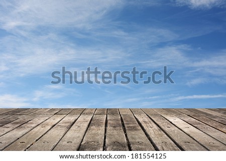 Wooden ground with copyspace on sky.