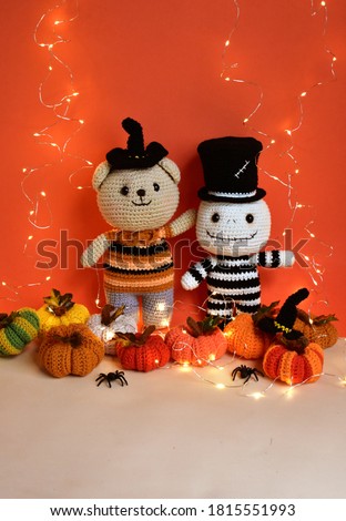 Halloween crochet with cute ghost, witch bear, pumpkins, spiders, knitting, handmade, kid, childhood, children, funny, toys in orange/ red background