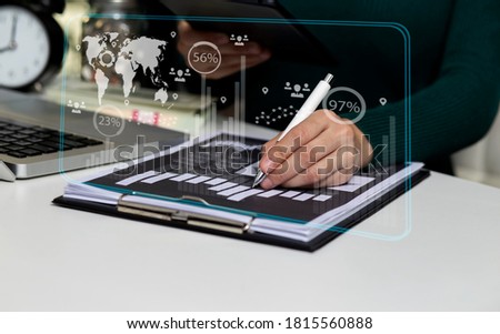 Double exposure of businesswoman hand working on tablet computer with digital network online virtual chart, Abstract icon, Business strategy concept, Background toned image blurred.