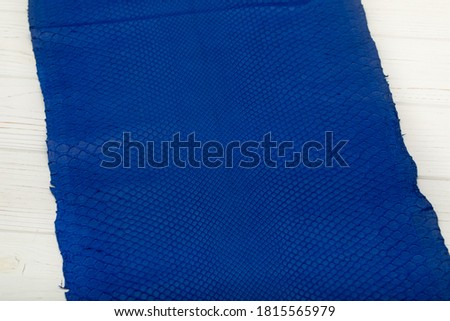Deep blue colored natural python leather
