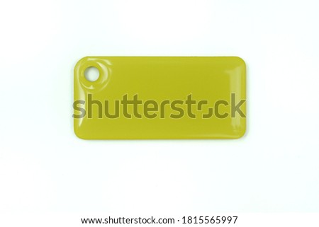 access card, glossy keychain isolated on white background, yellow, for access to protected areas under lock and key, with a place for an inscription, template