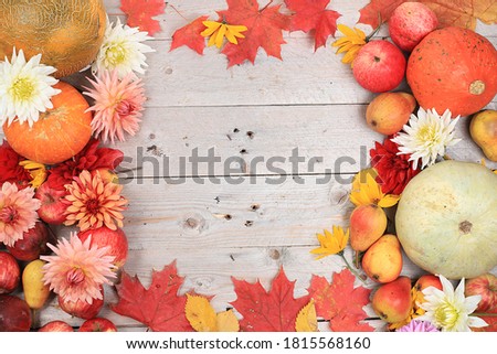 Happy Thanksgiving concept, postcard Autumn background with seasonal pears, pumpkins, apples and flowers on wooden background, copy space, selective focus. Harvesting, gifts of nature