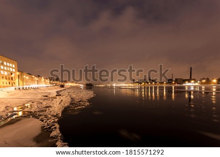 The Neva river in the winter night photo. city of Saint Petersburg