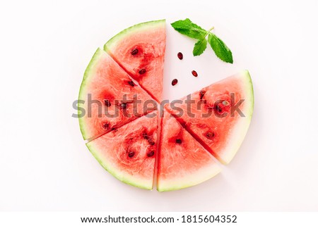 Watermelon pizza slices with mint leaves on white background. Top view