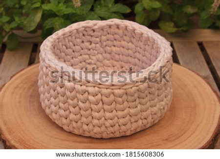 a knitted basket on the table