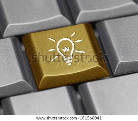 Computer key gold - light bulb