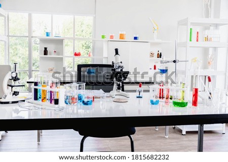 Microscopes, beakers, test tubes, and scientific laboratory equipment in scientific laboratories.