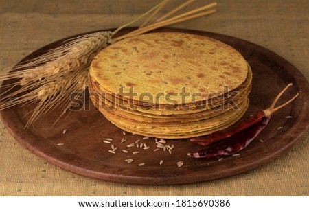 Indian Khakhra is a Traditional Gujarati Snack Also Know As Khakra, Crispy Roti or Fenugreek khakra, Khakhara’s are thin crackers made from wheat flour and oil. It is served usually during breakfast Royalty-Free Stock Photo #1815690386